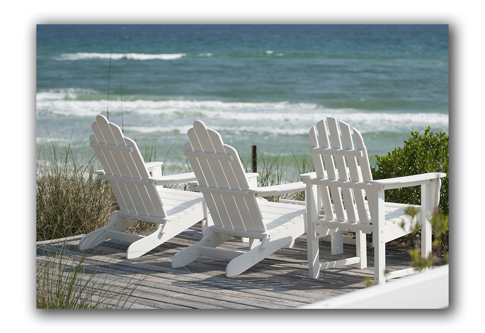 Image of deck chairs near the water